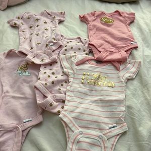 Five gently used NB onesies.